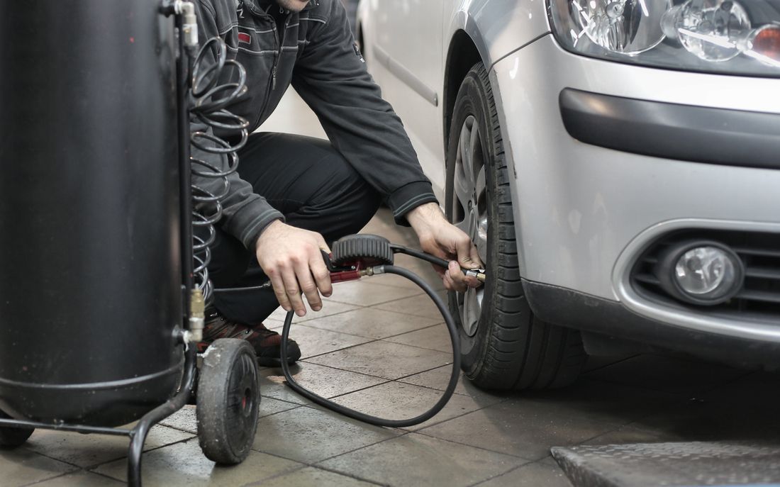 Checking tyre pressure in the workshop